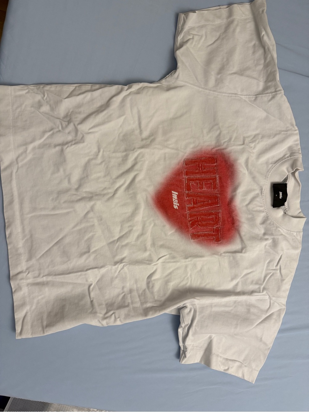 White T-shirt with red "HEART" graphic print